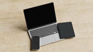 Computer, mobile and a tablet in a table